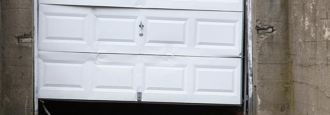 Garage Door Got Hit By A Car Dent Removal in Hialeah, FL